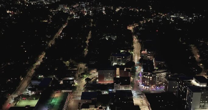 Ithaca, NY, USA - 05-18-2026  Night aerial hyperlapse video of downtown, commons, on a spring evening.