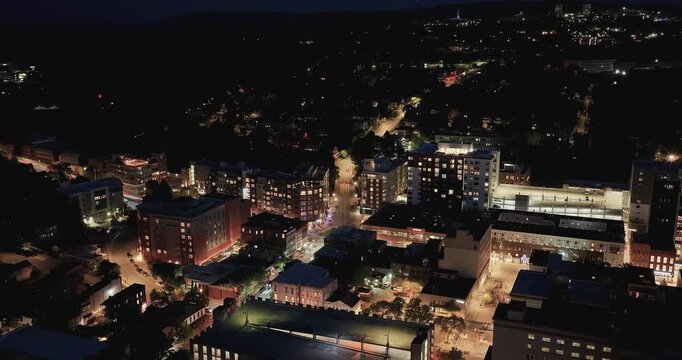 Ithaca, NY, USA - 05-18-2026  Night aerial hyperlapse video of downtown, commons, on a spring evening.