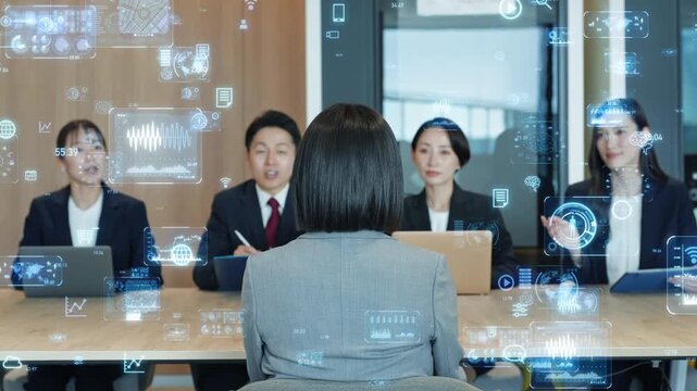 面接する男女ビジネスパーソンのグループとデジタルテクノロジーのコンセプト