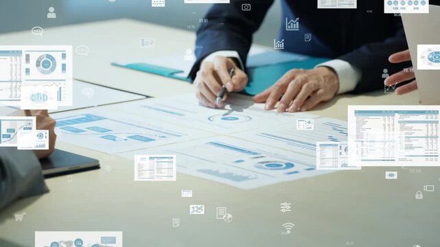 A group of male and female business professionals in a meeting and the concept of digital data