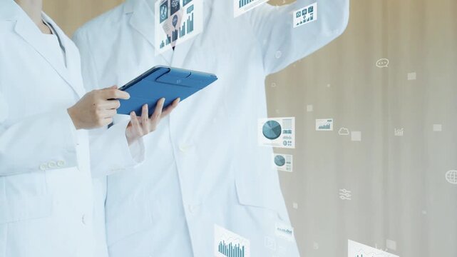 タブレットを見る男女研究者とデジタルデータのコンセプト