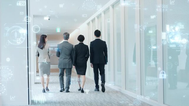 オフィスを歩く男女ビジネスパーソンのグループとデジタルテクノロジーのコンセプト