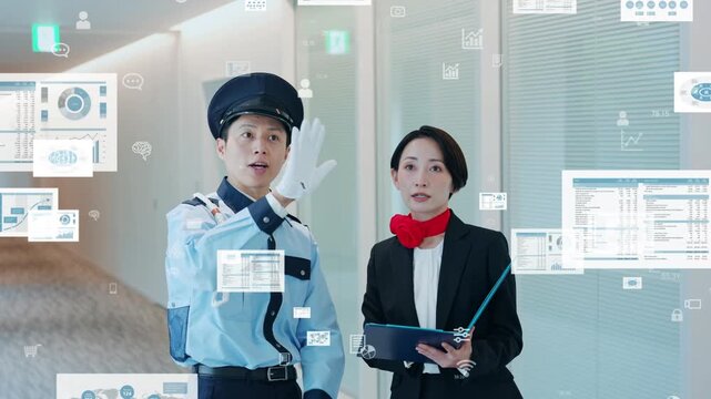 会話する男性警備員と女性スタッフとデジタルデータのコンセプト