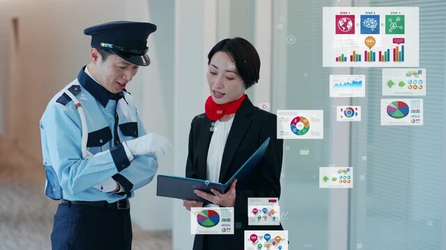 会話する男性警備員と女性スタッフとデジタルデータのコンセプト