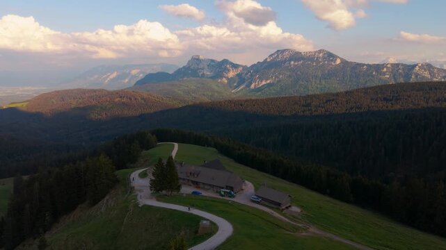 Aerial view of Stoisser Alm at Teisenberg during late afternoon light with alpine panorama, Germany.