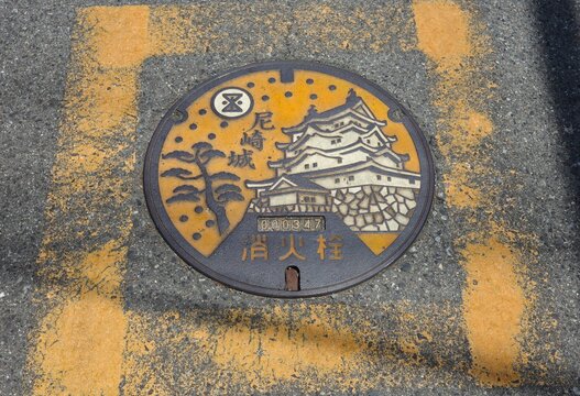 Japanese design manhole cover featuring Amagasaki Castle