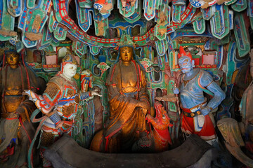 Fototapeta premium Ancient religious statue inside a shrine of the suspended temple Xuankong Si near Mount Heng, Datong, Shanxi, China