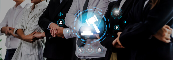 A diverse group of professionals stands together in a modern office, showcasing teamwork and collaboration in the field of law with digital legal icons representing justice and rights. Trope © InfiniteFlow