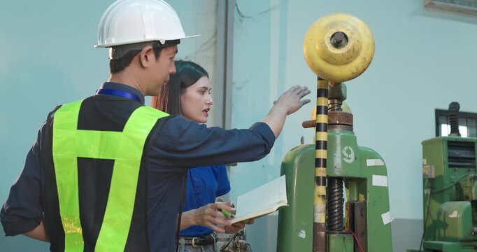 Engineer Demonstrates Product Testing Machine to Startup Entrepreneur in Small Lab Workshop