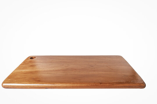 Empty Rectangle wooden cutting board isolated on white background. Side View chopping board. Cooking concept with Kitchen accessory and copy space for your products