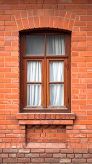 Obraz premium A red brick wall with a brown wooden window