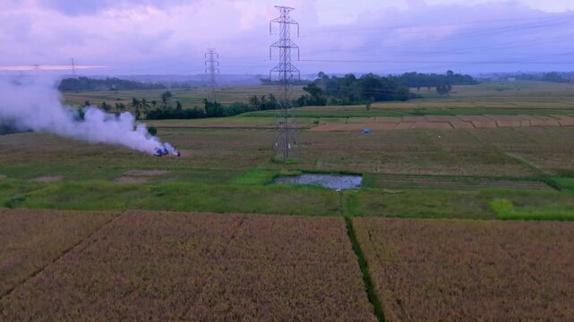 Aerial View of Subak Ketepeng Rice Fields with Transmission Towers at Dusk in Bali