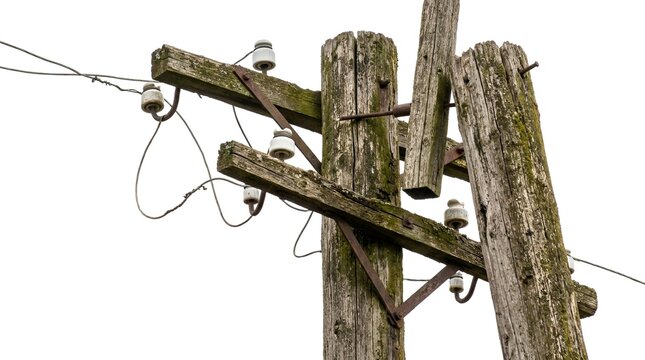 Close-up of Rustic Wooden Utility Pole with Electrical Wires and Insulators in Foggy Weather