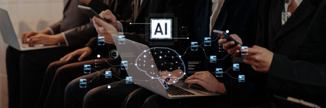 Business professionals engage with laptops and smartphones in a collaborative environment, showcasing artificial intelligence concepts and data interactions. Trope
