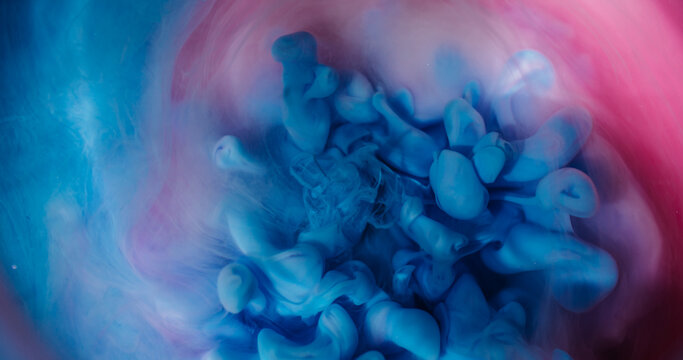 Defocused fume wave. Ink steam. Colorful smoke underwater art curl explosion. Blue pink purple vapor mixing on abstract background.
