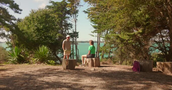 A nervous guy about to propose to his girlfriend on the coast