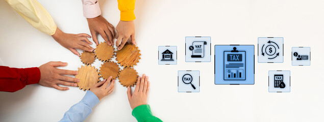 Obraz premium A teamwork scene with diverse hands assembling gears while digital tax icons represent the intricate process of tax preparation and financial planning. Trope