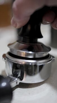 tamping espresso in a portafilter