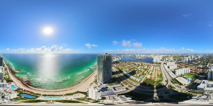 Amazing aerial 360 tour flying over skyscrapers on the beach in 8k 60p