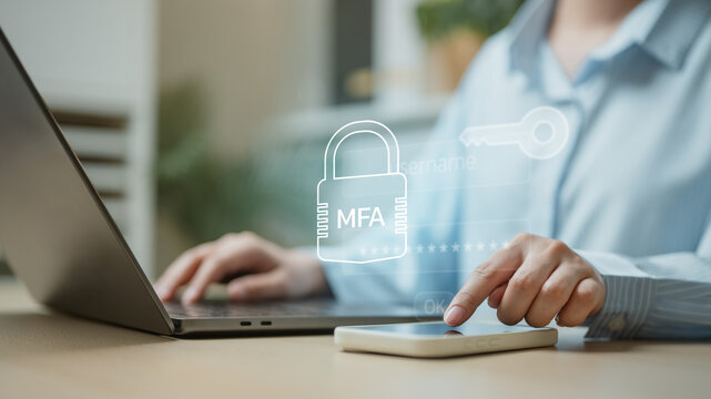 User verifying multi factor authentication on smartphone and laptop, representing cybersecurity, password protection, secure login access, and digital identity verification.