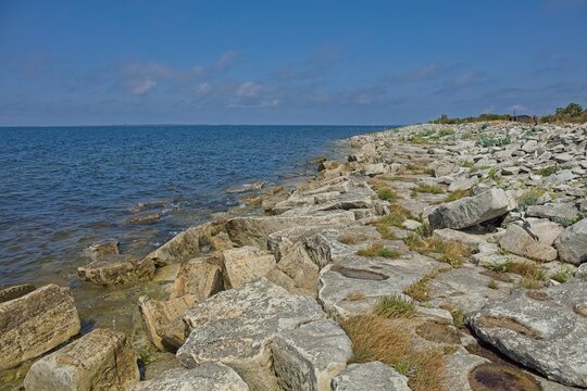 Rocky shoreline of Elda Pank (Elda cliff) in sunny summer weathe, Saaremaa, Estonia, Europe.