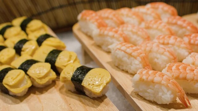 Assorted Japanese Sushi Nigiri and Maki Rolls on Buffet Display