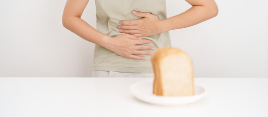 Gluten intolerance, Gluten free and celiac disease or Wheat allergy. woman with wheat bread and...