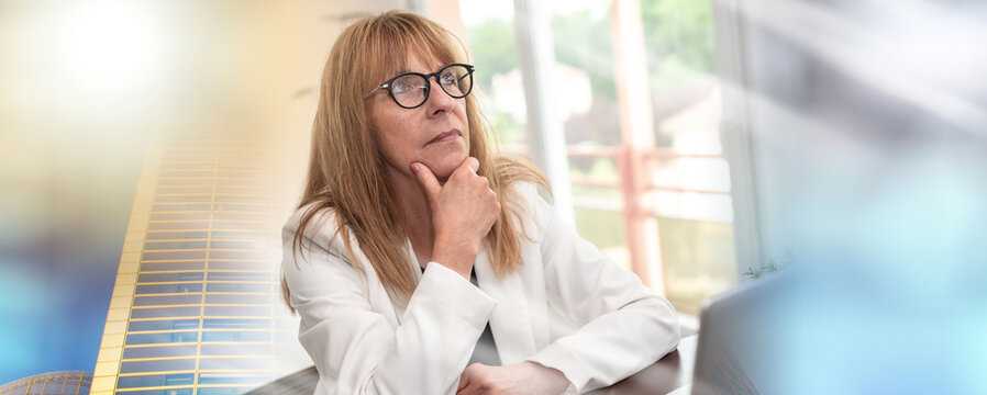 Portrait of thoughtful mature businesswoman; multiple exposure