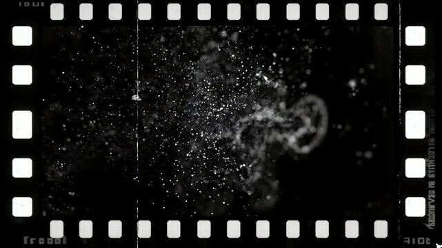 黒背景に白いフィルムダストが静かに漂うネガフィルム風ミニマル背景アニメーション