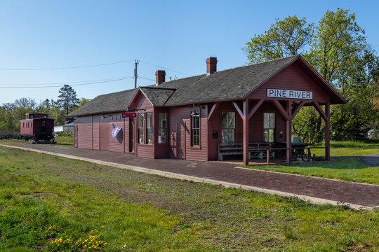 Historic Pine River Train Depot and Railroad Caboose in Rural Minnesota on Former Railway Line