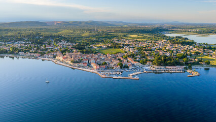 Obraz premium Aerial view of Bouzigues on the Thau Lagoon, in the Hérault department, Occitanie region, France