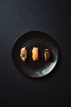 Assorted Sushi Platter with Salmon Nigiri and Rolls. AI generative.