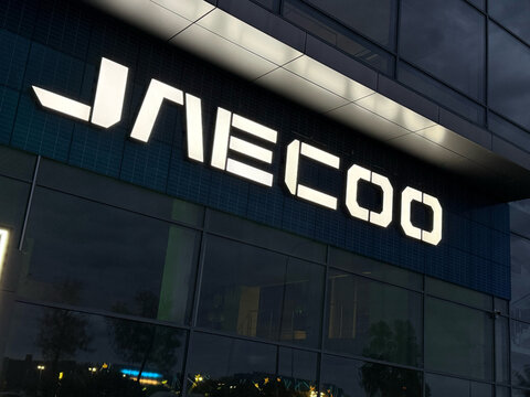 Facade of Jaecoo car store at nigyt. Jaecoo is an automobile manufacturer. Chinese Motor Corporation. Jaecoo Cars in the showroom. Brand owned by Chery Chinese automaker. 