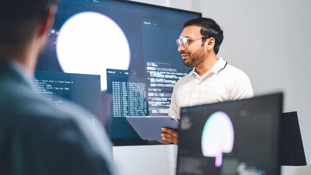 Adult indian engineer programmer presentation coding AI artificial intelligence algorithm coder training monitor developer expertise programming IT technology career