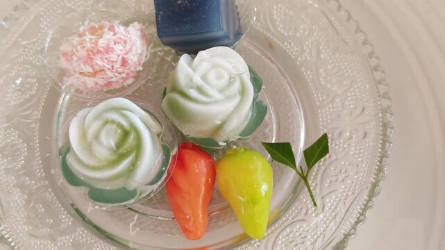 A background image of a variety of Thai desserts placed in trays and arranged beautifully.