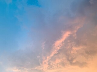 Fototapeta premium Cinematic pastel sunset clouds with soft gradient sky, captured in wide-angle focus for luxury wellness, meditation apps, inspirational branding, aesthetic wallpaper and social media themes.