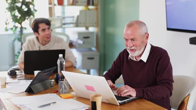Men office employees is genuinely happy and elated. Colleague shares joy. Winning lottery, approving contract