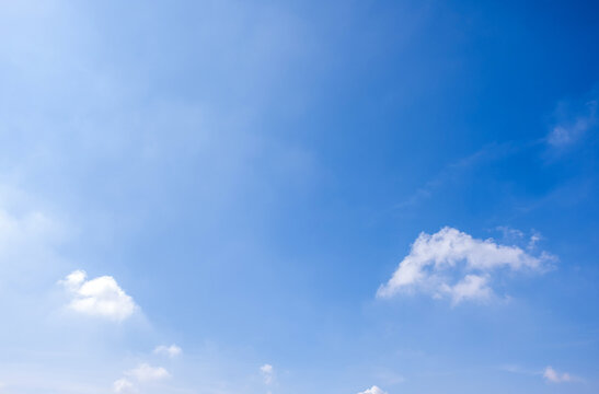 clear blue sky background,clouds with background, Blue sky background with tiny clouds. White fluffy clouds in the blue sky. 