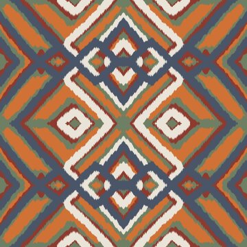 Seamless ethnic ikat pattern featuring vibrant orange and navy blue geometric grid motifs. Symmetrical tribal design perfect for bohemian fabric prints, wallpaper, and creative backgrounds.
