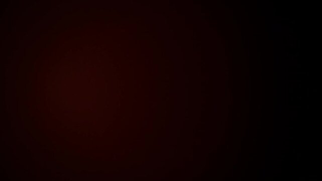 Red glowing light leaks pulsing on black background, film burn overlay, vintage cinema aesthetic, retro light flare, analog grain effect 4k video