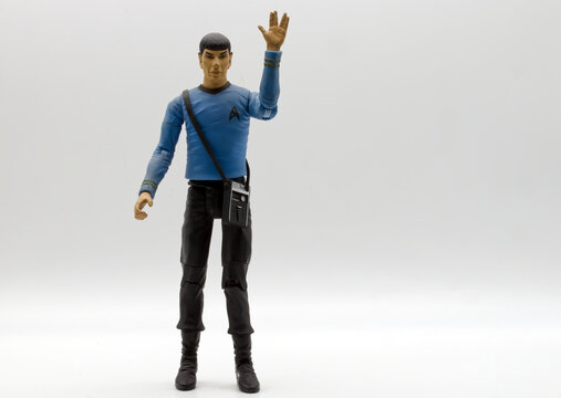 Bologna, Italy - May 2026: Mr. Spock action figure wearing the blue starfleet science officer uniform and making the Vulcan salute on a white background.
