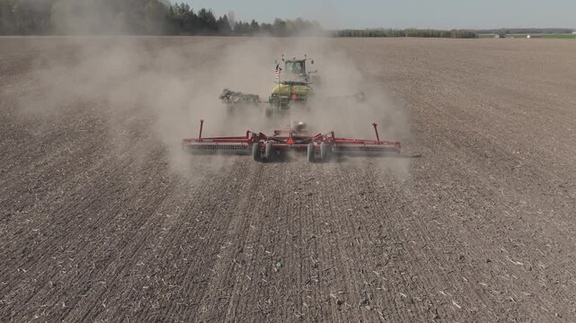 A farmer tills a farm field setting up the seed bed for the crop that will be planted.