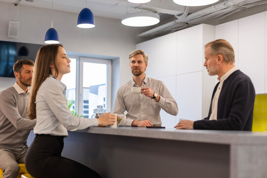 Business colleagues meeting for a coffee break, communicating and discussing work