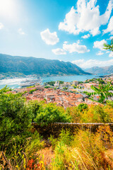 Naklejka premium Kotor Bay and the Old Town Kotor from the ancient San Giovanni fortress walls, featuring the Adriatic sea and majestic mountains, Montenegro.