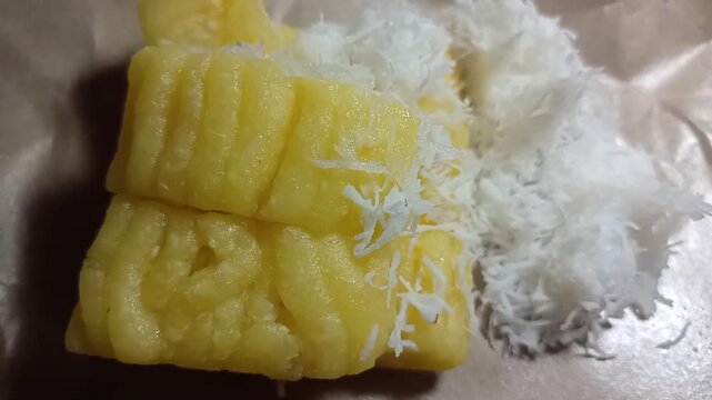Traditional Indonesian colorful getuk lindri cassava cake served with grated coconut
