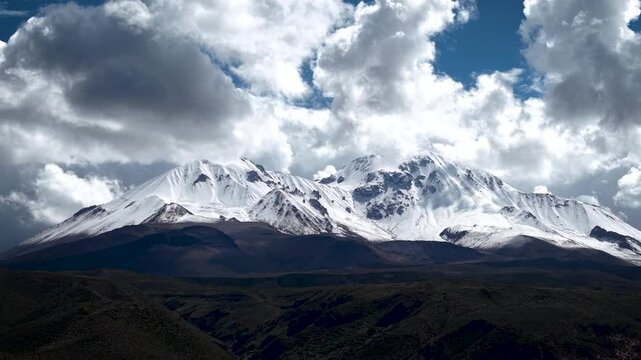 4K aerial drone footage of snowy Taapaca volcano in the Andes mountains
