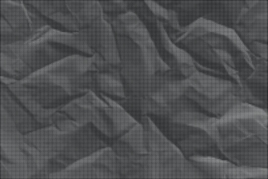 A close-up view of crumpled gray paper with many folds and creases on its surface