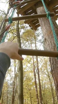 Safe climbing on rope ladder person POV