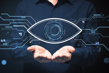 Digital eye interface held by open hands with futuristic circuit elements illustrating online network vision and modern monitoring technology concept. © Who is Danny