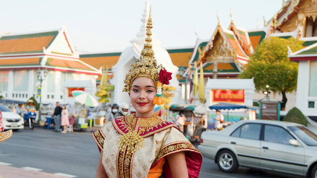 Thai Khon Dancer in Traditional Gold Costume at Wat Suthat Temple